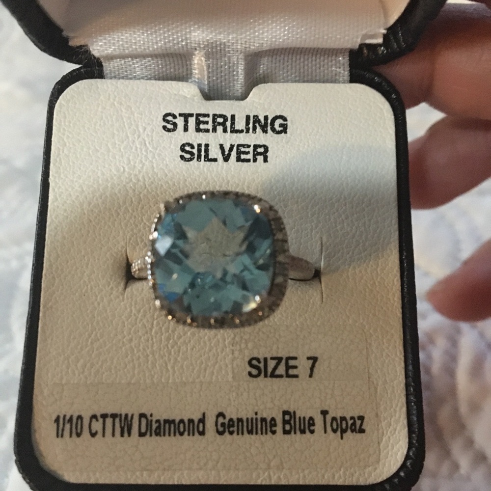 Genuine blue topaz and diamond ring in sterling